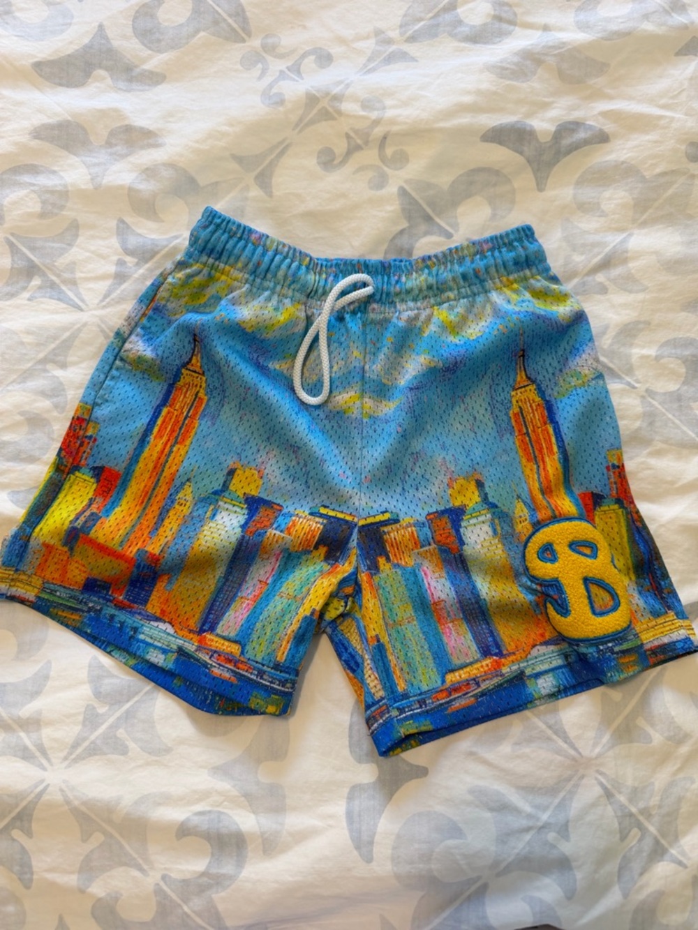 Boys Blue Cityscape Athletic Shorts with Yellow Accent